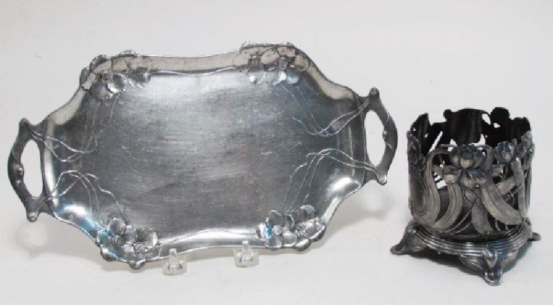 WMF WINE BOTTLE HOLDER & ORIVIT PEWTER TRAY: Art Nouveau metal ware lot comprised of a WMF German silver plated Jugendstil wine bottle holder, and an Orivit pewter Art Nouveau tray. Tray marked on base "Orivit", and wine bottle holder marker "WM