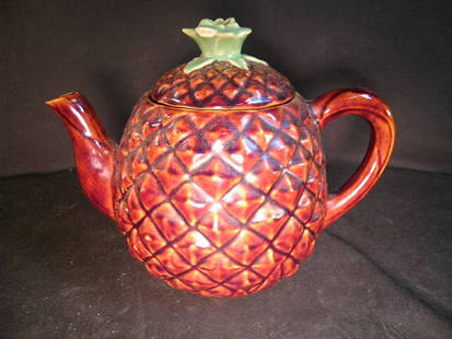 MAJOLICA POTTERY PINEAPPLE TEA POT ADVERTISEMENT: Cobbs Florida's Finest Fruit tea pot measures 9 1/2" wide x 6 1/2" high. Small chips on spout and flower.