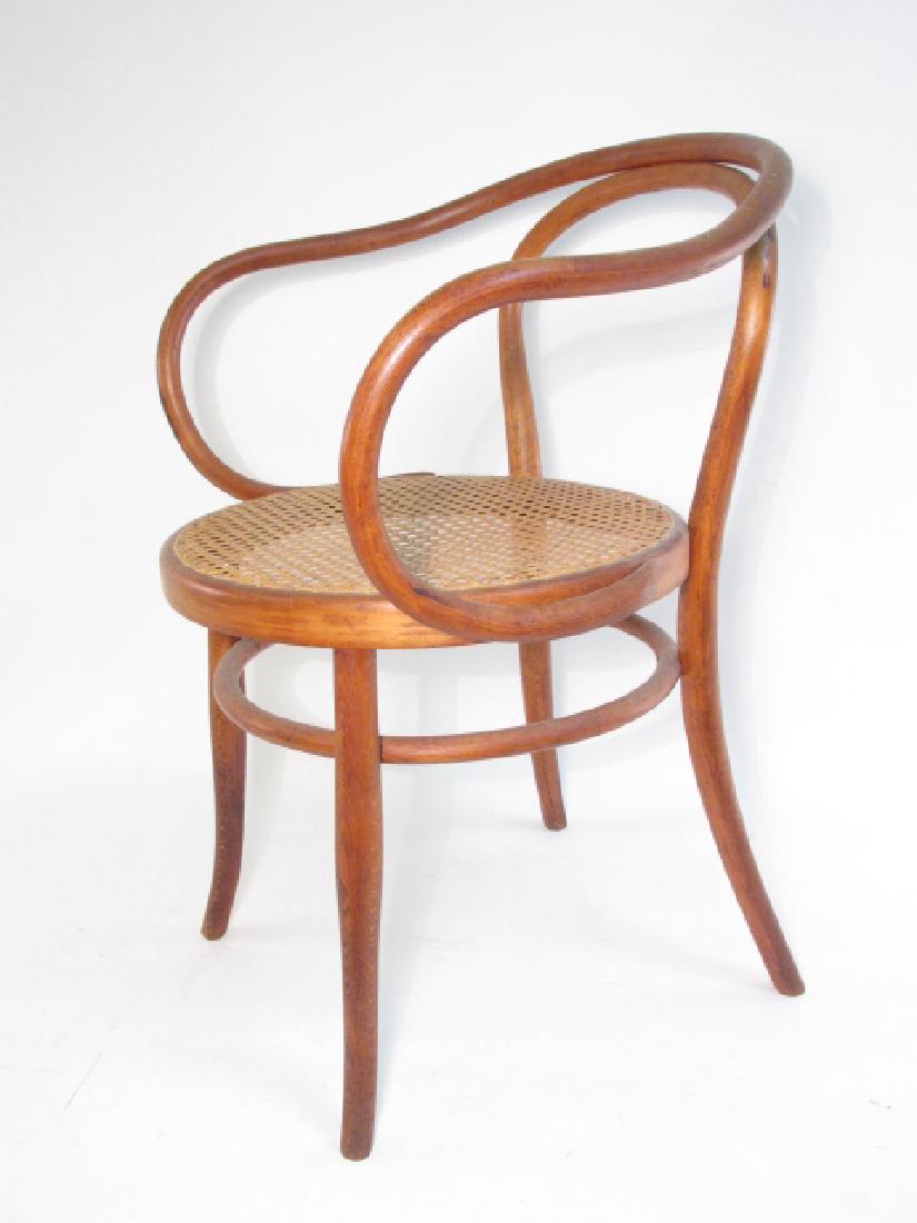 AUGUST THONET B9 BENTWOOD ARMCHAIR: August Thonet B9 bentwood armchair measuring 30.5" tall x 22" wide x 20" deep. AKA Corbusier chair, Viennese chair, or 6009 armchair. Caning on the seat intact. Condition: minor signs of wear and age