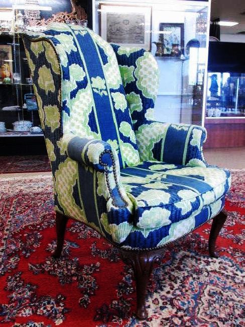 HENREDON FABRIC UPHOLSTERED WINGBACK ARMCHAIR: Henredon fabric upholstered wingback armchair measuring 47" tall x 33" wide and 34" deep. Marked under cushion with Henredon tag. Condition: some fading to parts of fabric, no apparent stains or tears