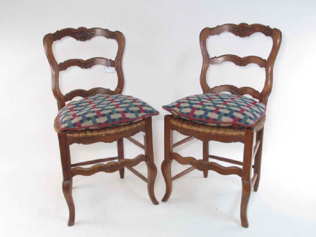 PAIR SMALL FRENCH COUNTRY STYLE LADDER BACK CHAIRS: Pair of small French country style ladder back chairs. Each chair measures 34" tall x 18" wide x approx. 18" deep. Condition: each chair has a repair to top rung of the ladder back, see images. Weight