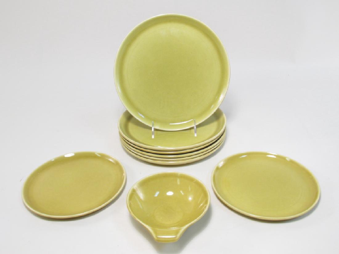 NINE PIECES RUSSEL WRIGHT STEUBENVILLE POTTERY: Nine pieces of assorted Russel Wright by Steubenville pottery. Includes (6) 10" dinner plates, (2) 8" plates, and (1) 6.75" long bowl with handle. Each piece incised on base. Condition: bowl has a sma