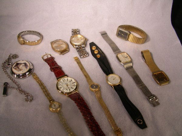 GROUP ASST WATCHES GRUEN MOULIN KATHY IRELAND ETC: Lot # 127: GROUP ASST WATCHES GRUEN MOULIN KATHY IRELAND ETC - Also includes Hilton, Seiko, faux Rolex, Pulsar. Total of 10 pieces. In various condition and working order.
