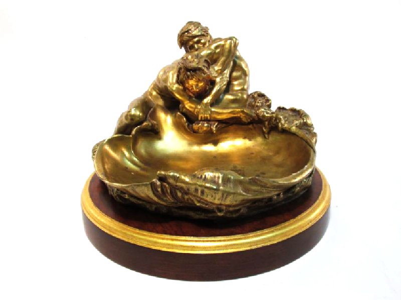 ART NOUVEAU INKWELL AFTER GUSTAV FREDERIC MICHEL: Art Nouveau gilt bronze figural inkwell after Gustav Frederic Michel, Siot Deauville Foundry. Cast in the form of two male nude river gods engaged in a struggler before a shell-shaped basin, the right