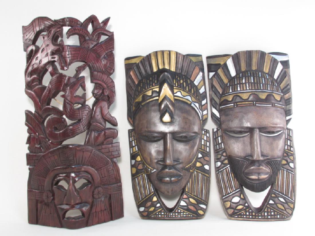 THREE TRIBAL STYLE CARVED WOOD MASKS (1 of 10)