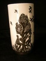 ROSENTHAL STUDIO LINIE AMROGOIO POZZI VASE SIGNED: Lot 313: ROSENTHAL STUDIO LINIE AMROGOIO POZZI VASE SIGNED - Block print style black and white design of man and woman beside a tree. Piece is signed on side. Measures 7" tall x 3 1/4" wide. No chips,