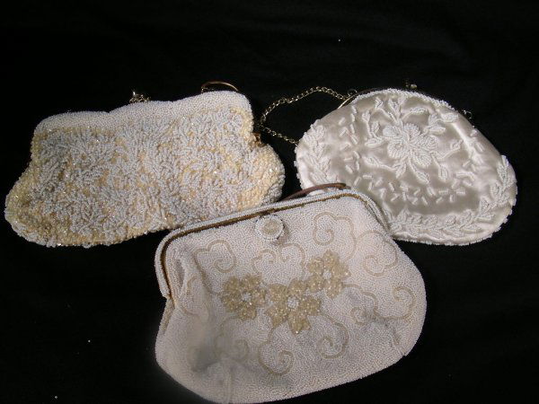 3 VINTAGE BEADED SEQUIN EVENING BAGS WHITE: Lot 368: 3 VINTAGE BEADED SEQUIN EVENING BAGS WHITE - Scalloped metal frame with all over bead and sequin design at 5 1/2" tall x 8 1/2" wide, floral micro beaded bag at 6 1/2" tall x 8" wide and ivor
