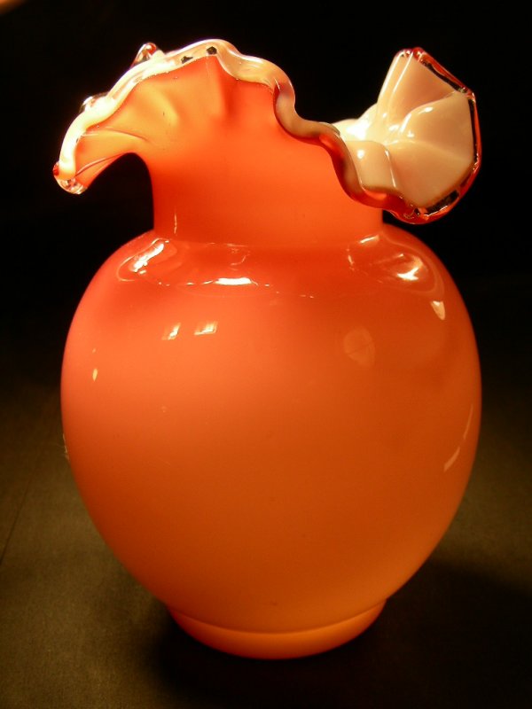 PINK CASED VASE SIGNED THOMAS WEBB AND SONS: Lot 523: PINK CASED VASE SIGNED THOMAS WEBB AND SONS - Measures 5 3/4" tall x 3 3/4" wide. Signature on bottom. Pink exterior with white interior. Ballerina ruffled collar. No chips or cracks.