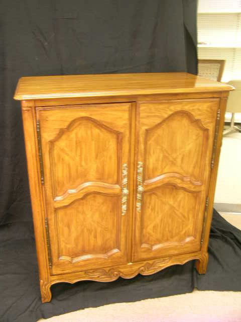 DREXEL HERITAGE TWO DOOR ENTERTAINMENT CENTER: Doors open and slide into cabinet. Pull out tray for t.v. Also tray for VCR and DVD. Center Measures 45 1/2" high by 41" wide and 23" deep. Skinny scratch to left side 5" long. TV tray measures 25" wi