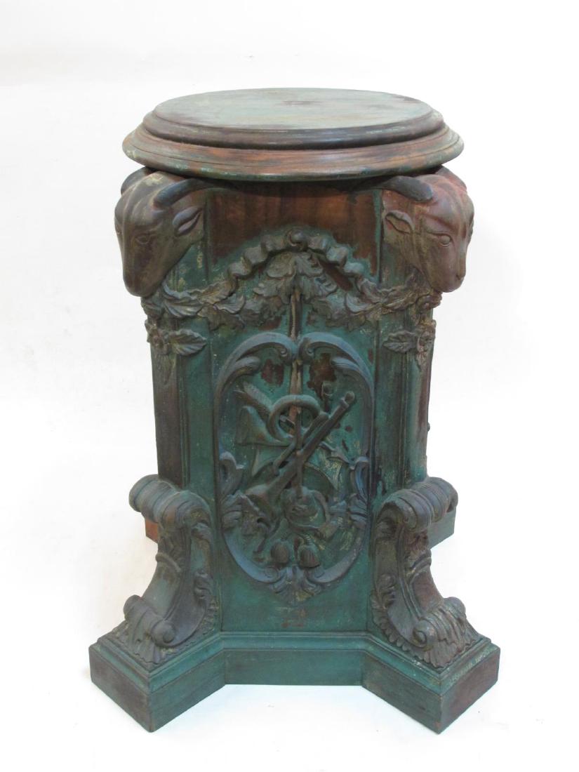 ANTIQUE SWISS BLACK FOREST CARVED WOOD PEDESTAL: Antique Swiss Black Forest carved wood pedestal stand. Large and heavy, measuring 30" tall x 22" wide. Remains of a verdigris tone paint (heavy wear). Condition: signs of age and wear, no apparent rep