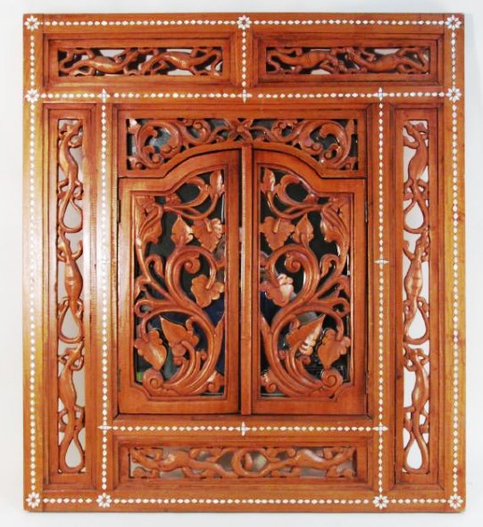 INDONESIAN CARVED TEAKWOOD WINDOW FRAMED MIRROR: Indonesian carved teakwood window framed mirror, also inlaid with mother of pearl. Condition: good, no signs of damage or repair, see images. Measures a total of 35" tall x 31.5" wide. Weight: 20 lbs.