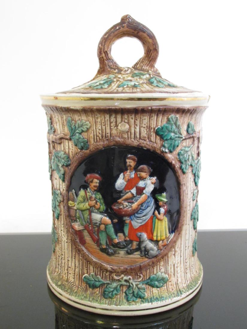 VINTAGE ALBERT THEWALT GERMAN PORCELAIN TOBACCO HUMIDOR: Vintage Albert Jacob Thewalt German porcelain tobacco humidor measuring 9" tall x 5.5" diameter. Marked on base. Condition: one small chip to outer rim, see images. Weight: 3.1 lbs.