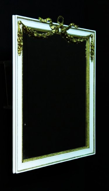 ANTIQUE LOUIS XV STYLE GILTWOOD WALL MIRROR: Antique Louis XV style giltwood wall mirror with ribbon and flower garland drape at the top. Measures 23.25" tall x 17.25" wide. Condition: good, no signs of damages, see images. Weight: approx. 7 lbs