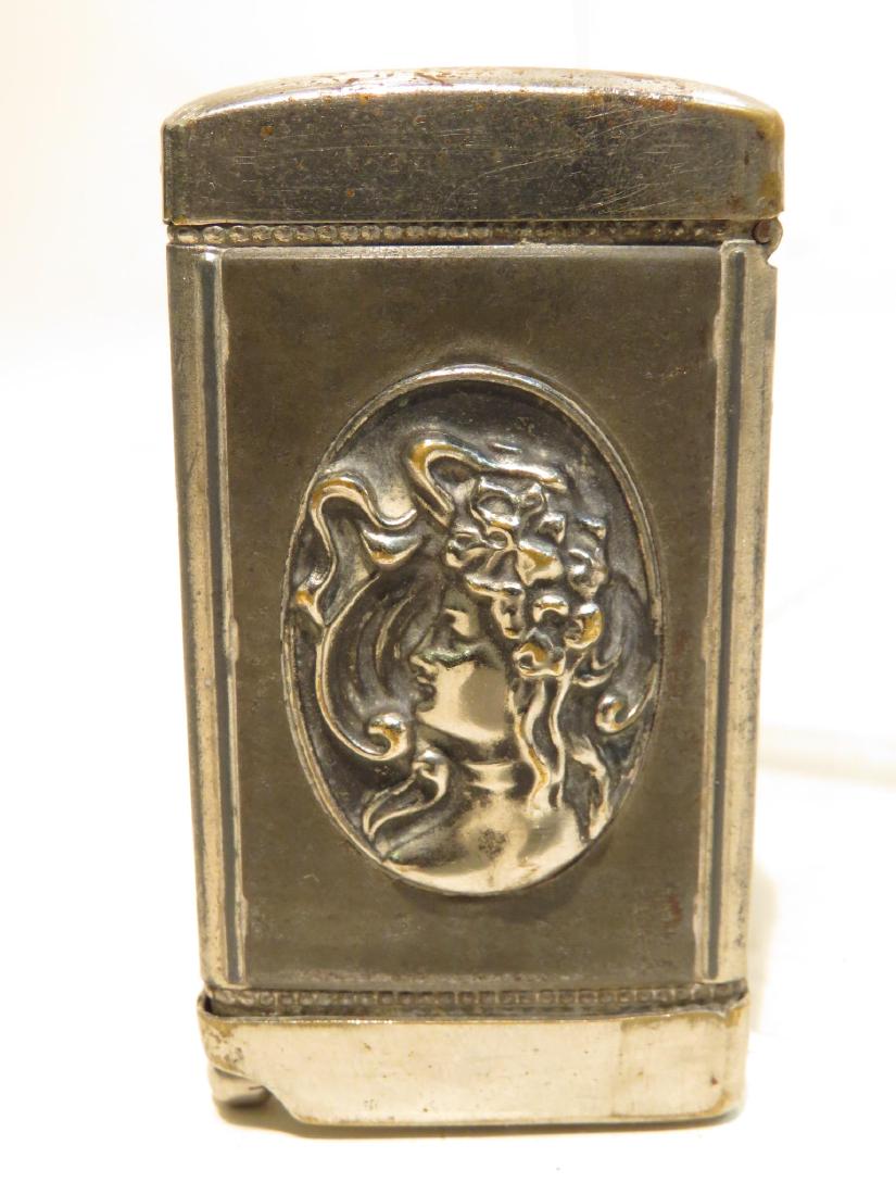 RARE ANTIQUE ADVERTISING MATCHSAFE CIGAR CUTTER: Rare antique advertising match safe and cigar cutter combo. Advertisement for Chas. Hopfner Wine & Beer Saloon on one side, and a silver cameo relief of a woman on the other. Condition: expected signs