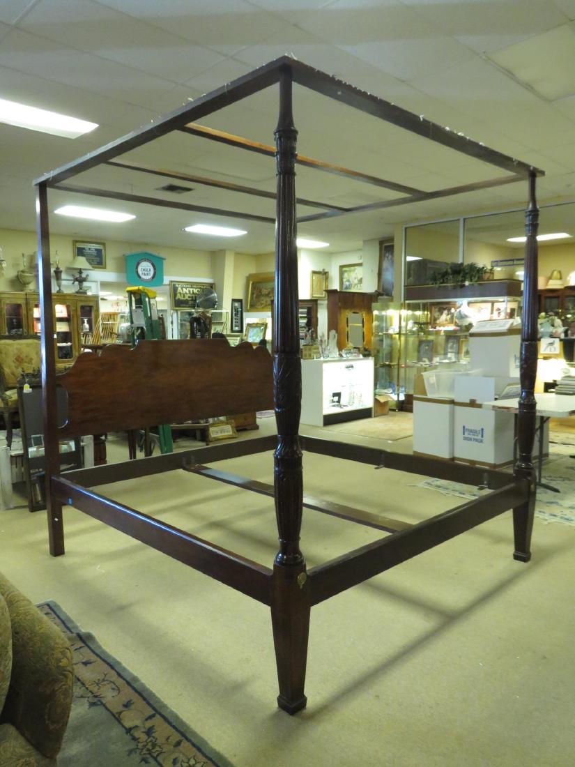 MAHOGANY FINISHED FOUR POSTER KING SIZE BED FRAME: Mahogany four poster king size bed frame, mismatched parts, as is. Measures 92" tall x 82" wide. Condition: as is, see images. Weight: approx. 80 lbs.