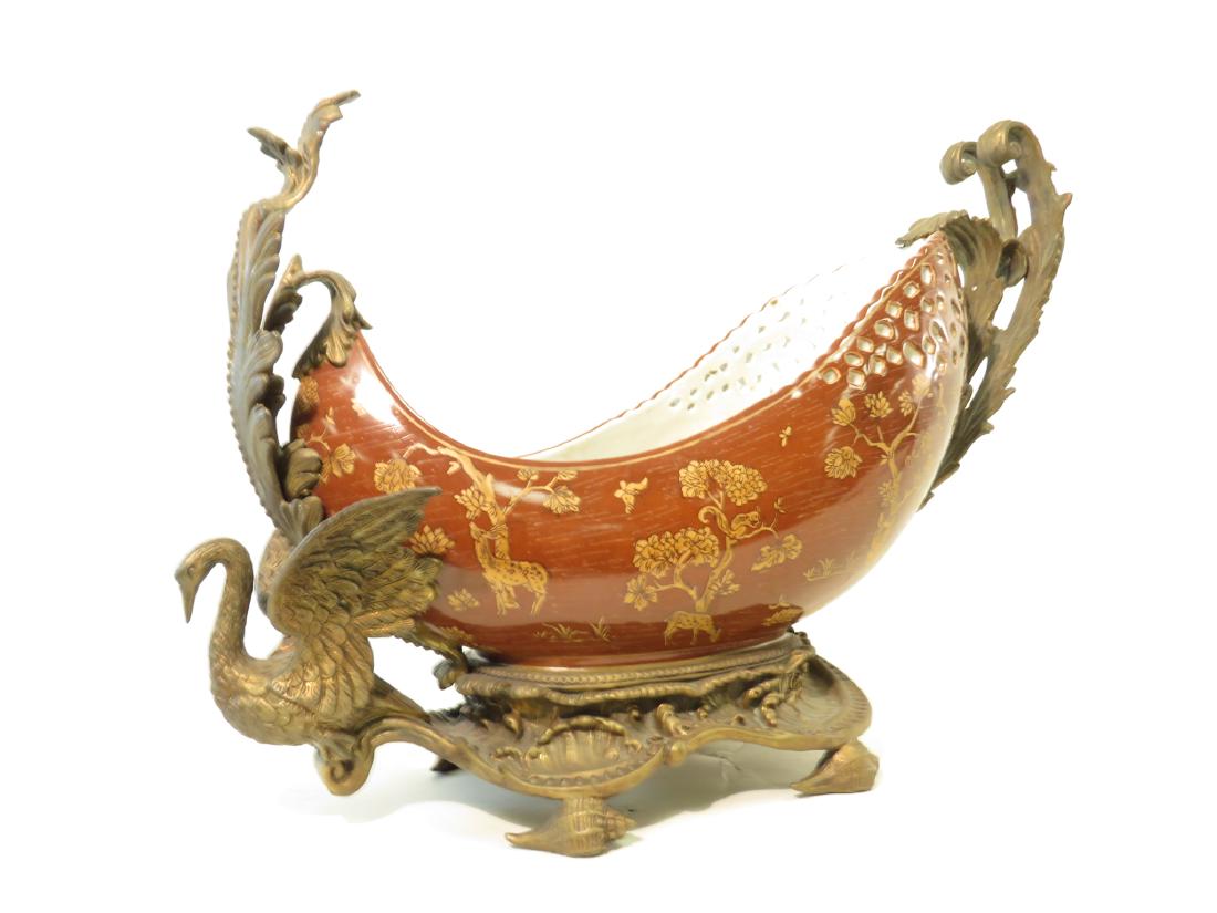 CASTILIAN SWAN CENTERPIECE BOWL: Castilian porcelain & metal mounted centerpiece bowl depicting a swan, seashells, & fauna. Approx Measures: Height: 13" x Length: 20" x Width: 8". Approx Weight: 15 lbs. Condition: Good, see pictures.
