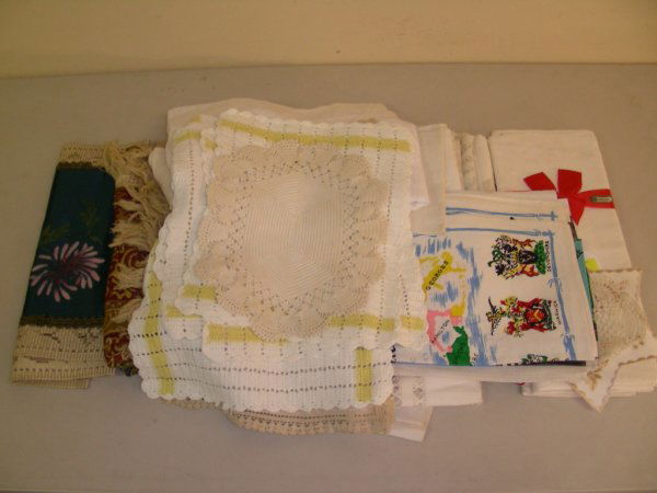 GROUP LOT TABLE LINEN CROCHET, CUT WORK ETC: Irish linen table cloth 68" round never used. Tatted doilies. Cut work table runners. Some have yellowed but are still in good condition see pictures