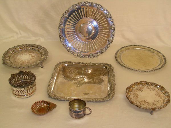 NICE ANTIQUE SILVER PLATE SALVERS TRAYS COASTER: A nice assortment of fancy silver plate includes three round footed trays of varying sizes, one flat round tray, one square tray, one wine coaster, a small copper shell and a small handled cup. The sq