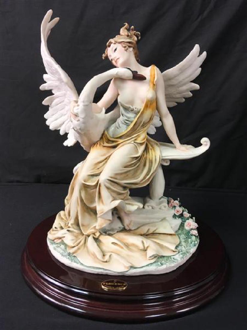 GIUSEPPE ARMANI FIGURE OF LEDA WITH SWAN: GIUSEPPE ARMANI FIGURE OF LEDA WITH SWAN: Ltd edition: 169 / 5000. Measures 11 1/2" x 9" x 14" tall. Oval plaque on front reads Giuseppe Armani. Base with Armani labels. Condition: good