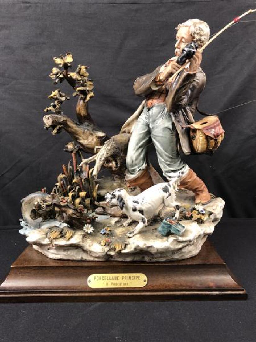 CAPODIMONTE LUCIANO CAZZOLA SCULPTURE FISHERMAN: Italian Capodimonte porcellane prinicpe porcelain sculpture by Luciano Cazzola, titled "Il Pescatore". Measures 13.75" tall x 11.5" wide. Condition: good, see images. Weight: approx. 10 lbs.