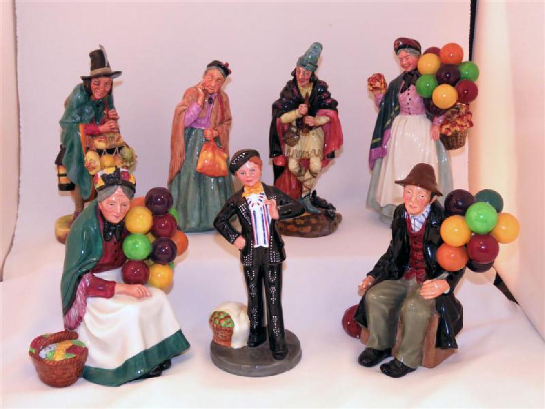 SEVEN ROYAL DOULTON FIGURINES: Group of seven Royal Doulton porcelain figurines: Biddy Pennyfarthing HN1843, Old Balloon Seller HN1315, Bridget HN2070,The Pied Piper HN2102, Pearly Boy HN2767,The Balloon Man HN1954, and The Mask Se