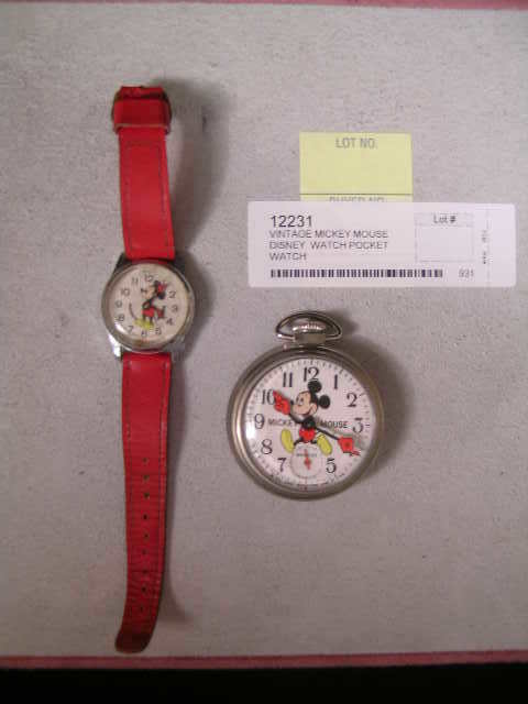 VINTAGE MICKEY MOUSE DISNEY WATCH POCKET WATCH: VINTAGE MICKEY MOUSE DISNEY WATCH POCKET WATCH - Mickey Mouse watch on red leather band. Watch is not in working condition, missing winding stem. Discoloration to face. Face measures 1 1/2" long x 1"