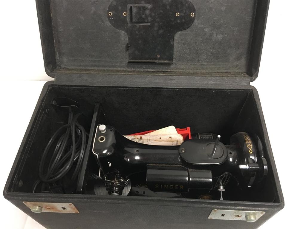 VINTAGE SINGER FEATHERWEIGHT 221 SEWING MACHINE: Vintage Singer Featherweight 221 sewing machine. Working condition. Includes power cord. Condition: very minor signs of age, no signs of damages, see images. Weight: 17.3 lbs.