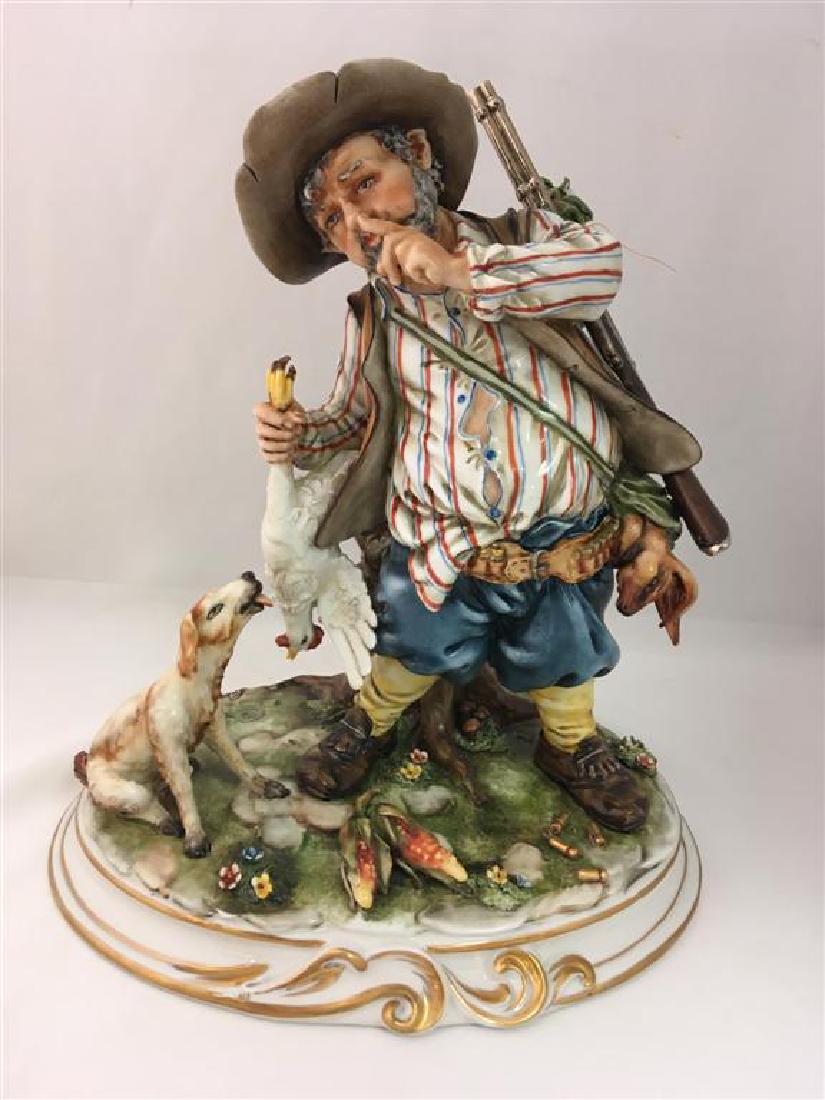 CORTESE CAPODIMONTE PORCELAIN FIGURE HUNTER W/ DOG: CORTESE CAPODIMONTE PORCELAIN FIGURE: HUNTER W/ DOG. Measures: 12.5" tall x 10" wide and 8" deep. Condition: one small break on leaves of one branch. Capodimonte mark on reverse. Artist signature and