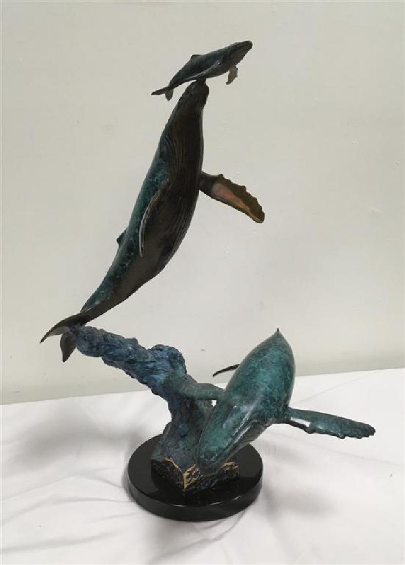 WYLAND BRONZE SCULPTURE: THREE IN THE SEA: Robert Wyland sculpture, 'Three in the Sea' depicts three humpback whales at the moment when the mother humpback whale raises her newborn calf to the surface as the escort whale circles nearby. Signed