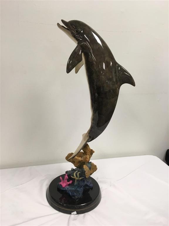 ROBERT WYLAND BRONZE: DOLPHIN DREAM SCULPTURE: Robert Wyland enameled bronze dolphin, "Dolphin Dream" sculpture. Ltd Ed. 1134/2000. Signed. Measures: 11" x 13" x 31" tall. Condition: one 1.25", and one 0.25" scratch, and one small nick through the