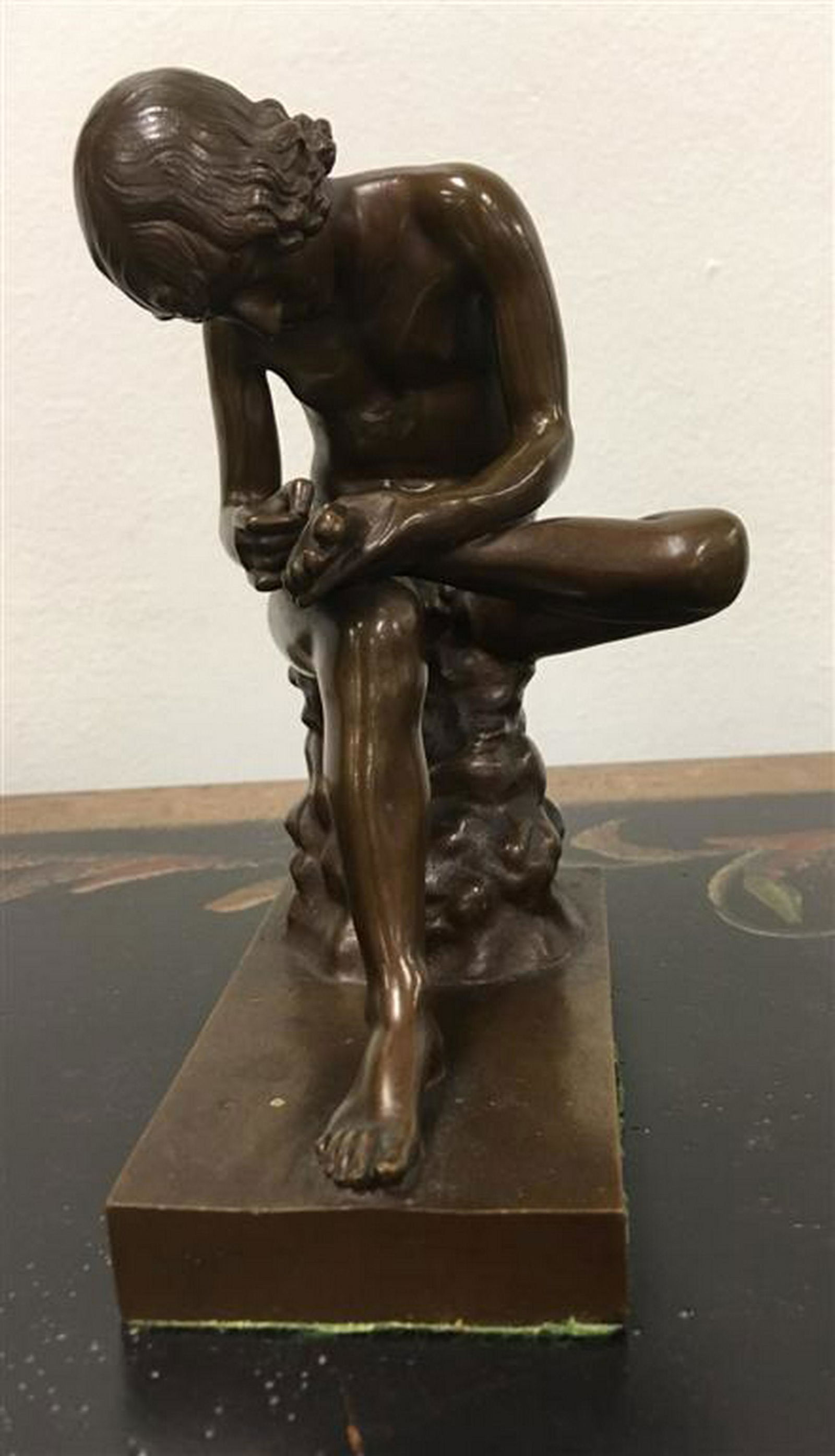 FERDINAND BARBEDIENNE BRONZE SCULPTURE "SPINARIO": Antique Ferdinand Barbedienne bronze sculpture titled "Spinario". Depicting a boy pulling a thorn from his foot. Signed on backside of base "F. Barbedienne, Fondeur-". No foundry mark. Condition: good