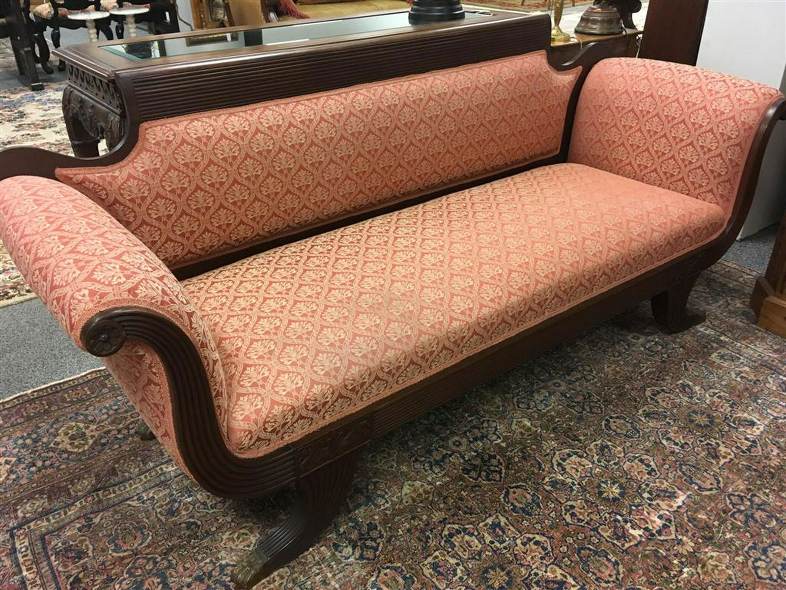 VINTAGE DUNCAN PHYFE STYLE MAHOGANY SOFA: Vintage Duncan Phyfe style carved mahogany sofa measuring a total of 80" long x 34.5" tall and 30" deep. Condition: good, minor signs of normal age and use, fabric is in good condition, see images. We