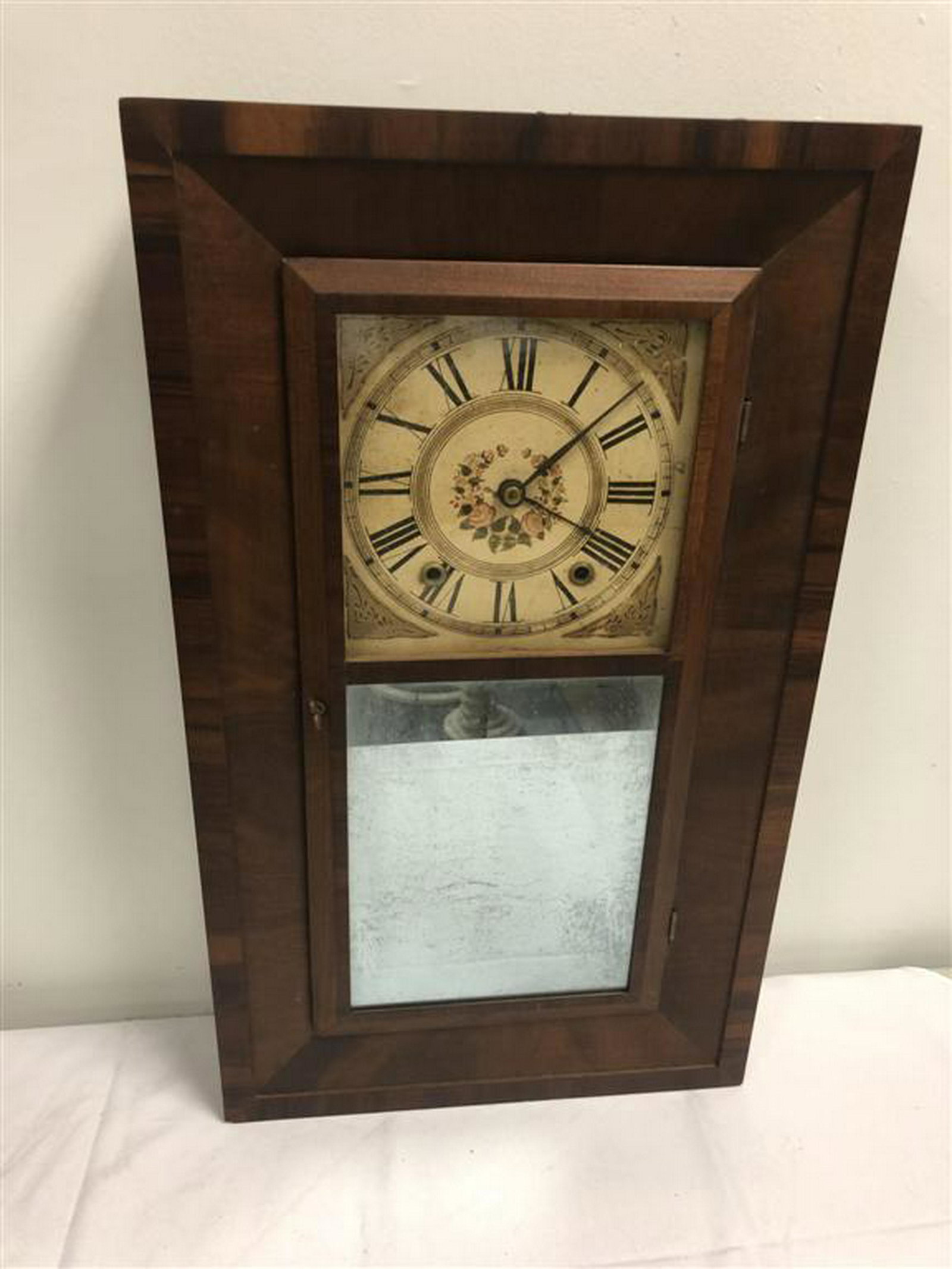 RAY, CARPENTER & CO OGEE WOODEN WORKS CLOCK: Ray, Carpenter & Co Ogee wooden works clock. Appears to be original painted dial, mirror, glass, hands, pendulum and key. Case is in good condition with only minor signs of normal use. No weights incl
