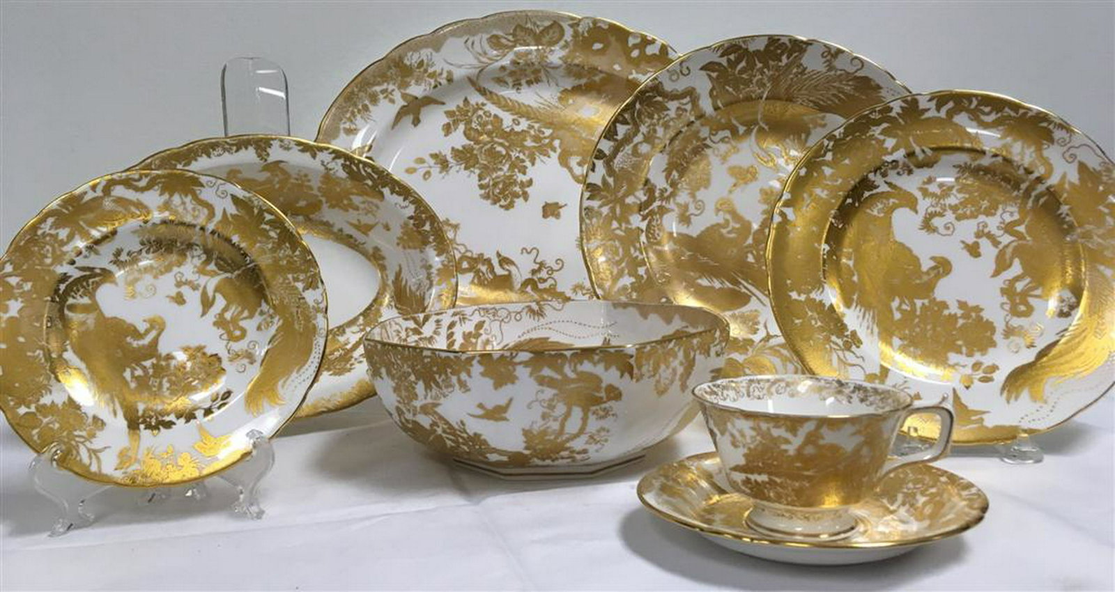 ROYAL CROWN DERBY "GOLD AVES" DINNERWARE FOR 12: Royal Crown Derby "Gold Aves" porcelain dinnerware service for twelve. 63 total pieces. Includes (12) 10.5" dinner plates, (12) 8.35" salad plates, (12) 6.25" bread plates, (12) 5.75" saucers, (12) 3.