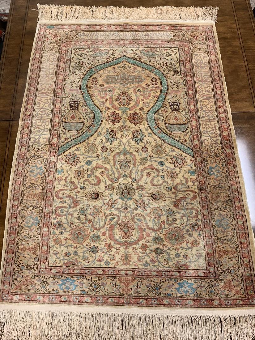 FINE TURKISH HEREKE SILK & SILVER THREAD PRAYER RU: Extremely fine Turkish Hereke silk and silver thread hand made prayer rug. Measures 35" x 49" long. Signed at one end, also decorated with various Islamic calligraphy designs. Condition: good, no hole
