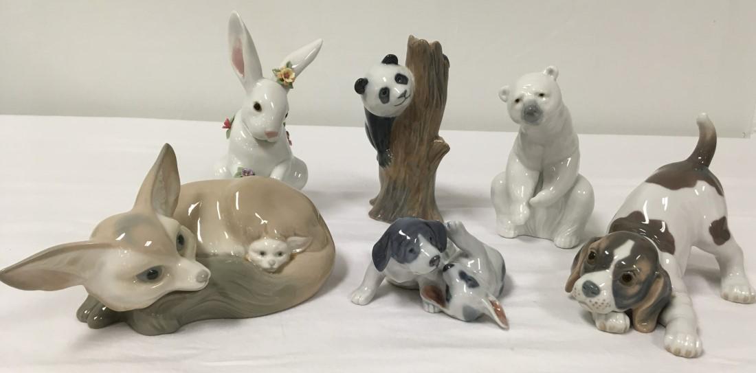 SIX LLADRO & ROYAL COPENHAGEN FIGURINES: Lot of six Lladro and Royal Copenhagen porcelain figurines. Includes Lladro: Polar bear, puppy dog, savannah cat, and rabbit. Copenhagen includes Panda bear and two puppies. Condition: rabbit is missi