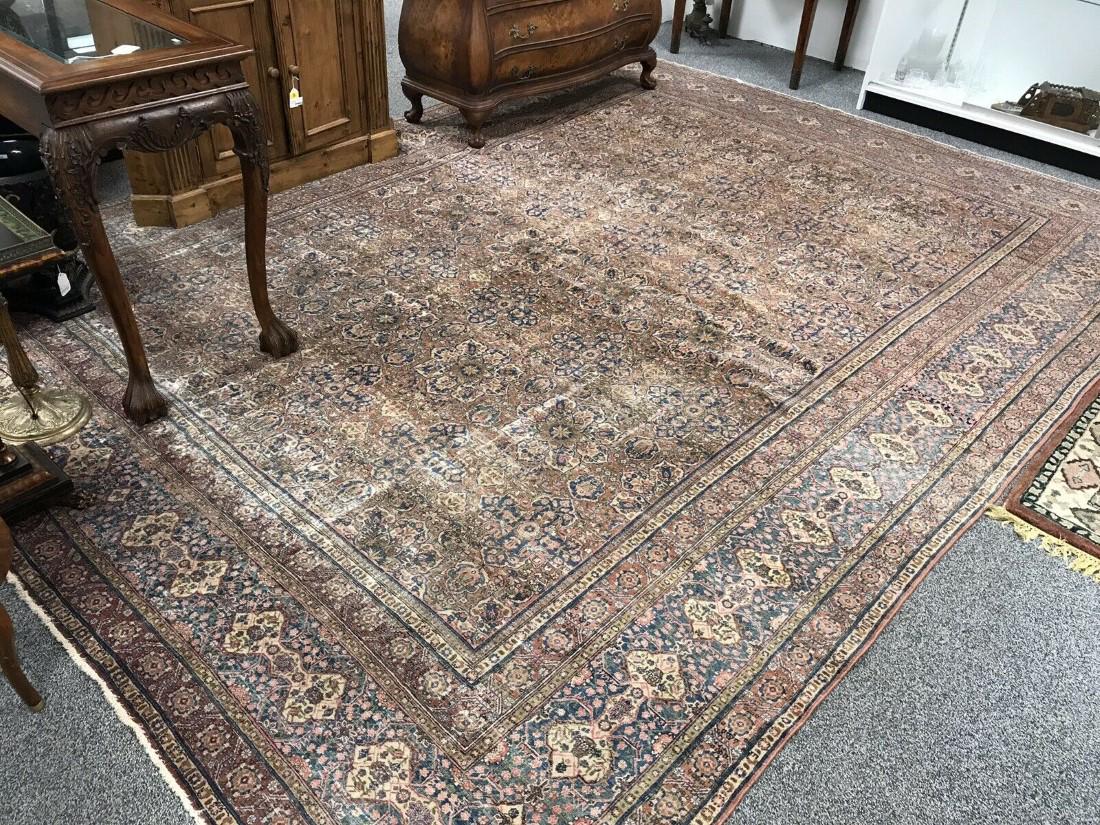 ANTIQUE MASHAD PERSIAN WOOL RUG 10' X 14': Antique Mashad Persian wool area rug measuring 10'3" x 13'7". Magnificent intricate pattern. Fine knot count. Condition: heavy wear to pile, re-coloring, no apparent tears or stains, see images. Weigh