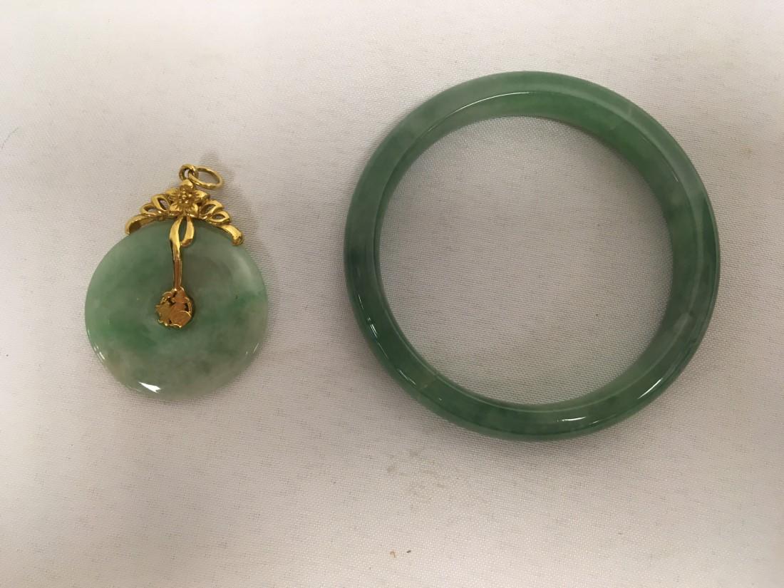 VINTAGE CHINESE JADE & GOLD: BANGLE & PENDANT: Vintage Chinese jade lot. Includes a carved jade bangle bracelet and a jade and 22k gold pendant. Condition: bangle has a crack, no damage to pendant, see images. Bangle measures 70mm outer diameter, 