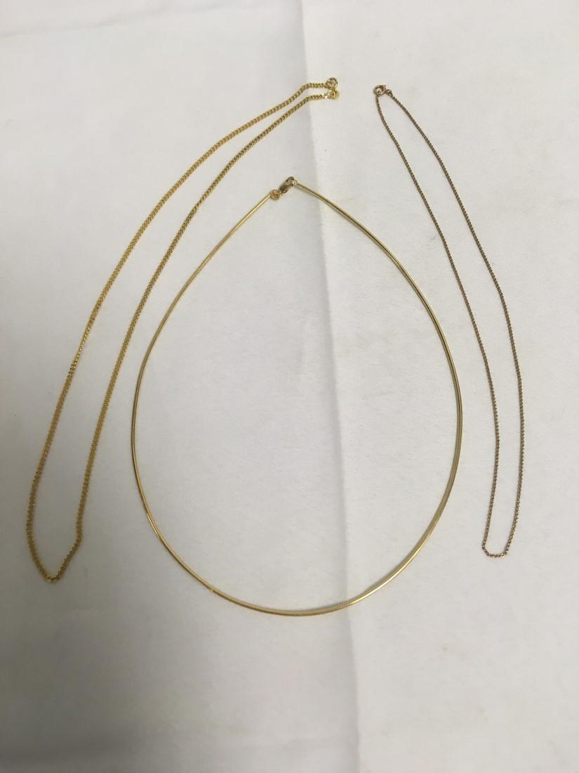 THREE 14K YELLOW GOLD CHAIN NECKLACES: Lot of three 14k yellow gold chain necklaces. Includes a snake link chain, a cuban link, and a very fine chain link. All three are stamped 14k. Condition: good, see images. Weight: 16.7 grams.
