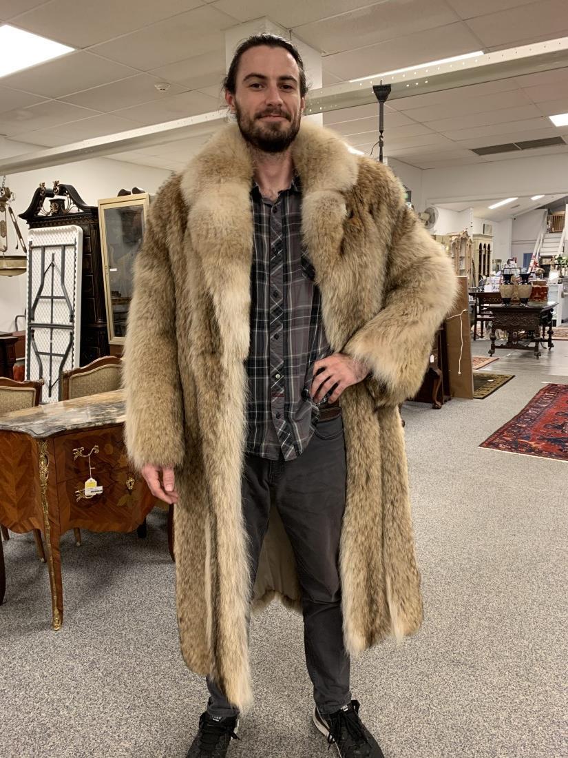 VINTAGE MEN'S FULL LENGTH COYOTE FUR COAT: Vintage men's full length coyote fur coat. Measures 23" shoulder to cuff, 22" shoulder to shoulder, 53" from top of collar to hem, and 54" total width at waist. Original tag. Condition: good, very min