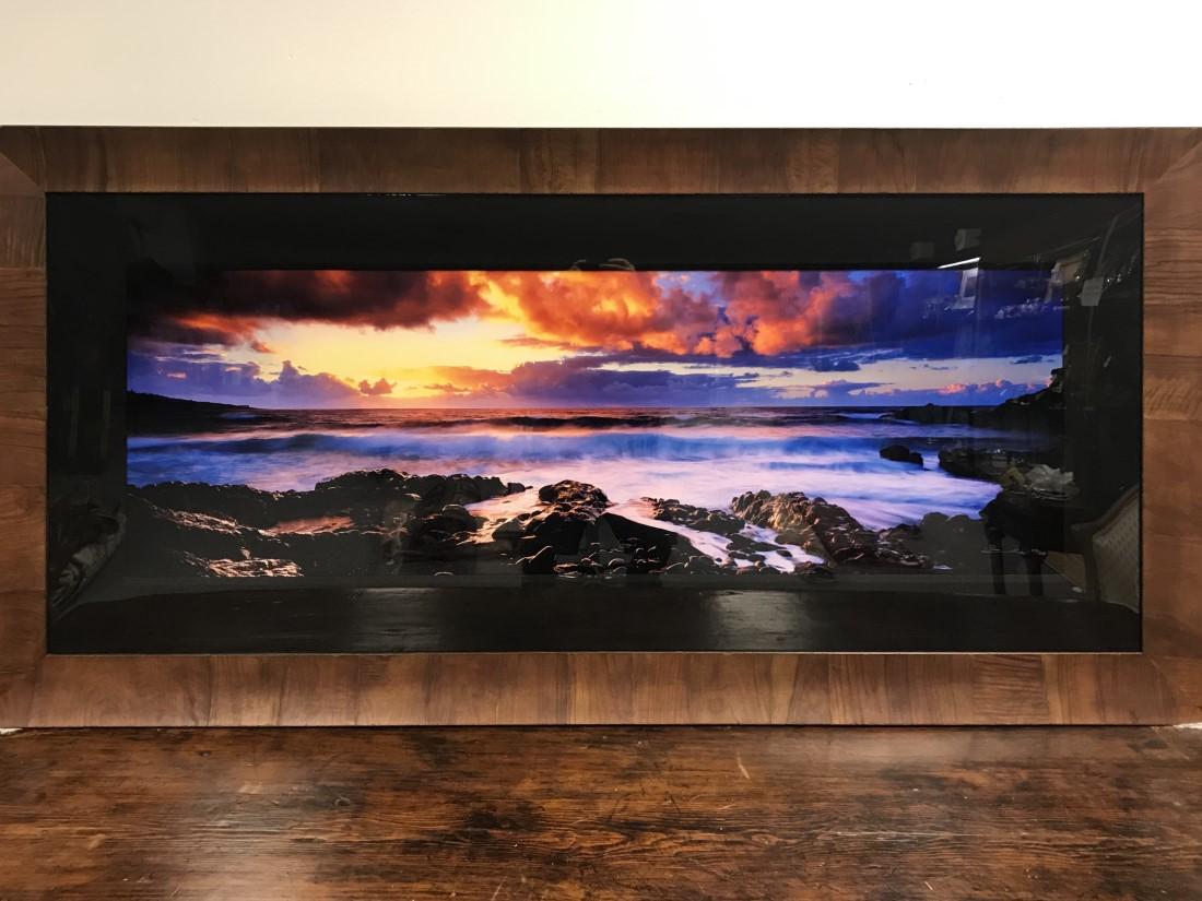 PETER LIK L.E PANORAMIC PHOTOGRAPHIC PRINT GENESIS: Peter Lik panoramic silver halide Fuji crystal archive print. Subject: sunset, titled "Genesis". Limited edition, numbered 570/950 and hand signed lower right. Original olive wood veneer scoop style f