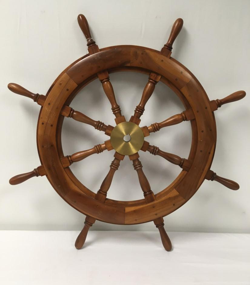 VINTAGE NAUTICAL TEAK & BRASS 36" SHIPS WHEEL: Vintage nautical teak and brass 36" diameter ship's wheel. Mounted with two hooks for hanging on a wall. Condition: minor signs of normal use to wooden finish, see images. Weight: 22 lbs.