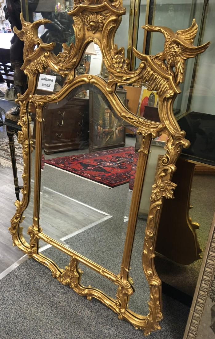 LARGE BAROQUE STYLE MIRROR WITH SWANS: Large gilded baroque style mirror with swan decoration. Measures 35" wide x 58" tall. Condition good.