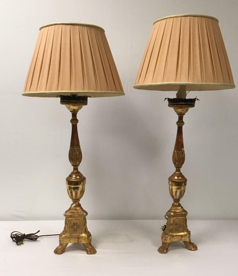 PAIR ANTIQUE ITALIAN GILTWOOD ALTAR CANDLESTICK LA: Pair antique Italian giltwood altar candlesticks as table lamps. Each one measures 42.5" tall to finial, or 28" tall to top of wood. Shades each measure 11.5" tall x 18.5" wide. Condition: minor scatt