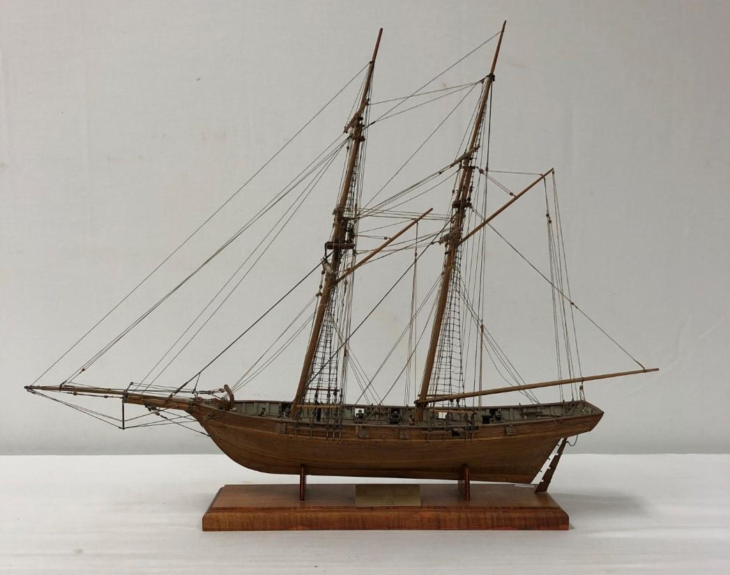 DAPPER TOM BALTIMORE CLIPPER HAND MADE MODEL SHIP: Dapper Tom Baltimore Clipper hand made model ship by Bill McLearn. Measures a total of 25" long x 19.5" tall x 9" wide. Title plate on base. Condition: one pulley has broken off its mount and needs to