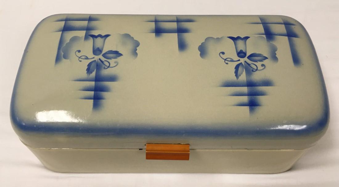 GERMAN ART DECO ENAMELED METAL BREAD BOX: German Art Deco enameled metal bread box. Blue decoration on a cream ground. Unmarked. Condition: cracking to enamel near handle and hinges, signs of age and use, see images. Measures 18.5" wide x 6.7