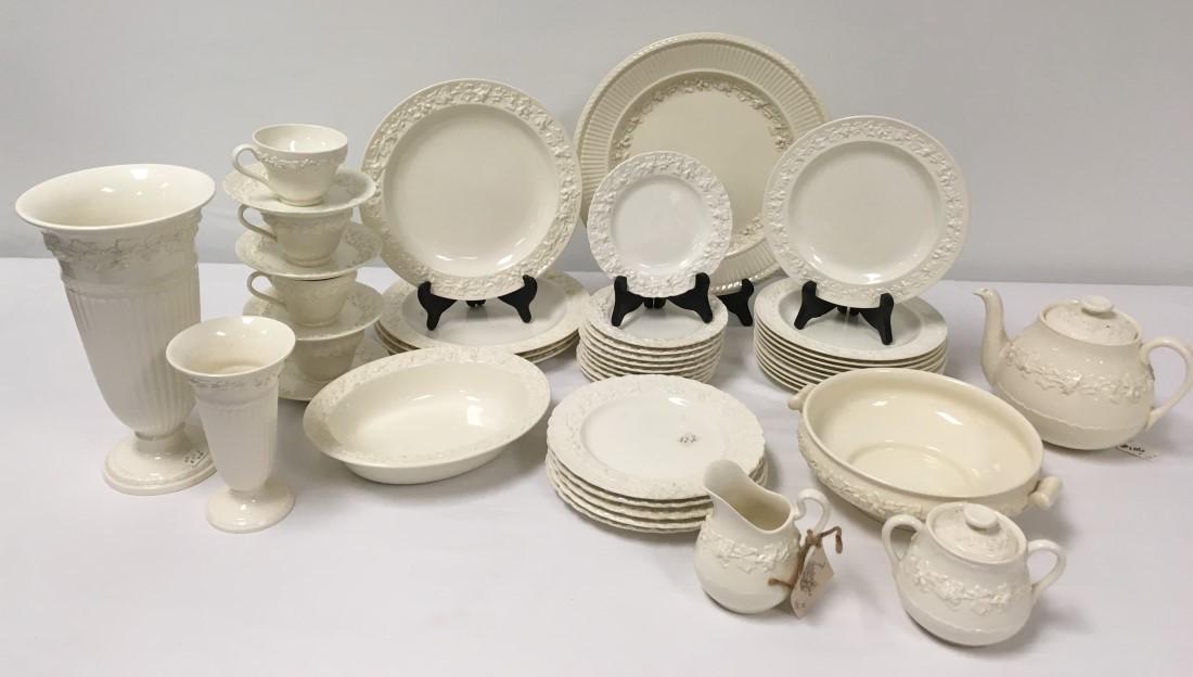 WEDGWOOD EMBOSSED QUEENSWARE PORCELAIN DINNERWARE: Wedgwood Embossed Queensware porcelain dinnerware. Includes (10) 8.25" plates, (5) 8" plates, (4) 6" saucers, (4) 4.5" rim to handle cups, (4) 10.25" plates, (10) 6.25" plates, (1) 10" wide handled bo