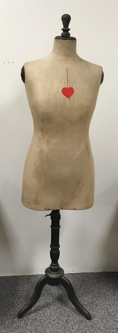ANTIQUE DRESS FORM MANNEQUIN: Antique dress form mannequin measuring 62" to top of finial x 15" wide at shoulders. Ebonized wood tripod pedestal base. Condition: minor discoloration to muslin fabric, wear to wood finish, see image