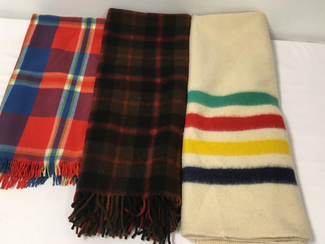 THREE VINTAGE WOOL BLANKETS: HUDSON'S BAY CO ETC.: Lot of three vintage wool throw blankets: Hudson's Bay Company (68" x 53"), Wool of the West (56" x 51") and Pendleton (50" x 63"). Minor soiling to Hudson's bay blanket. Small hole to Wool of the Wes