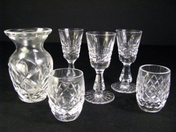 WATERFORD CUT CRYSTAL KYLEMORE GLASSES & VASE 6pcs: Group of Waterford cut crystal Kylemore glasses. Two shot glasses 2 1/4" high by 1 3/4" wide. Three cordial glasses 4" high by 2" wide, one glass has a 1/8" chip along upper rim. One small bud vase 4